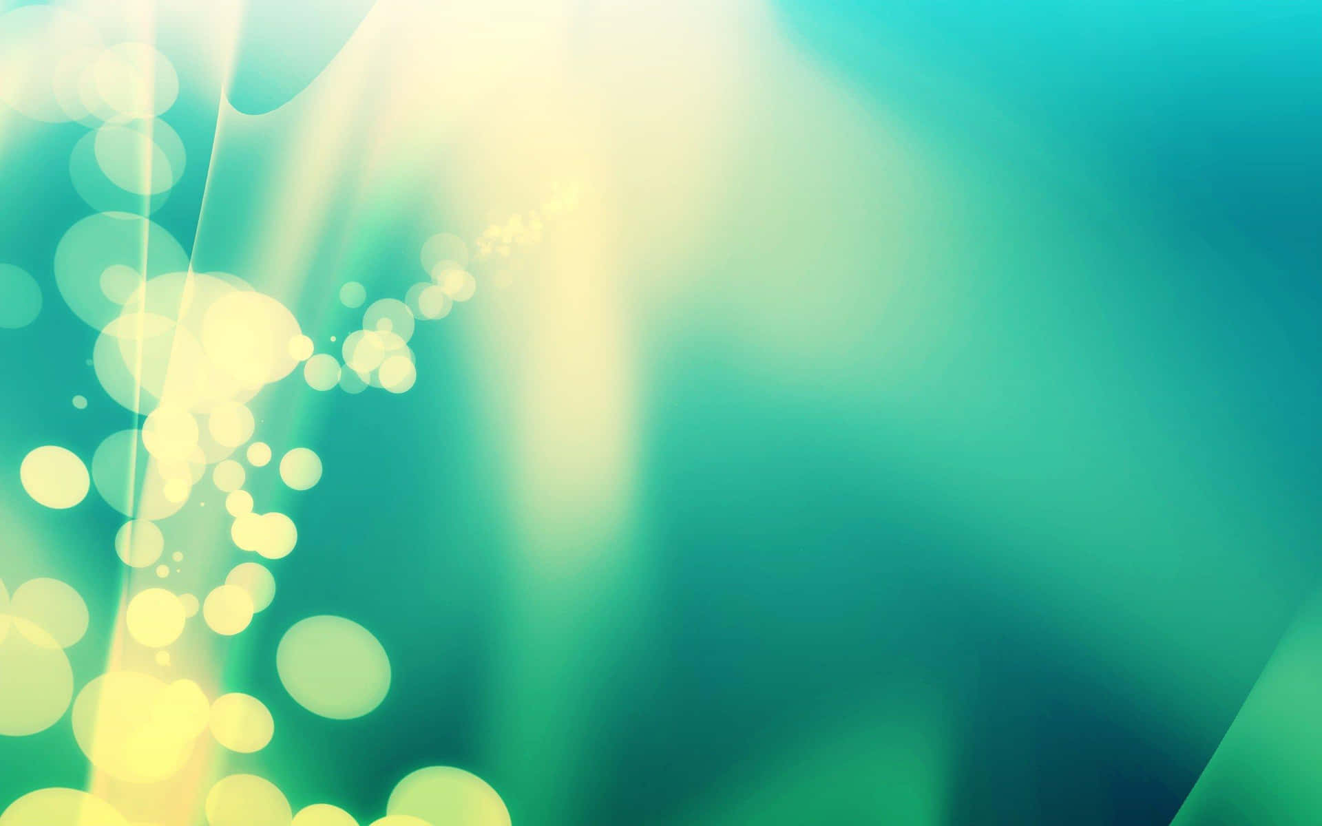 A Green And Yellow Abstract Background With Bokeh Lights