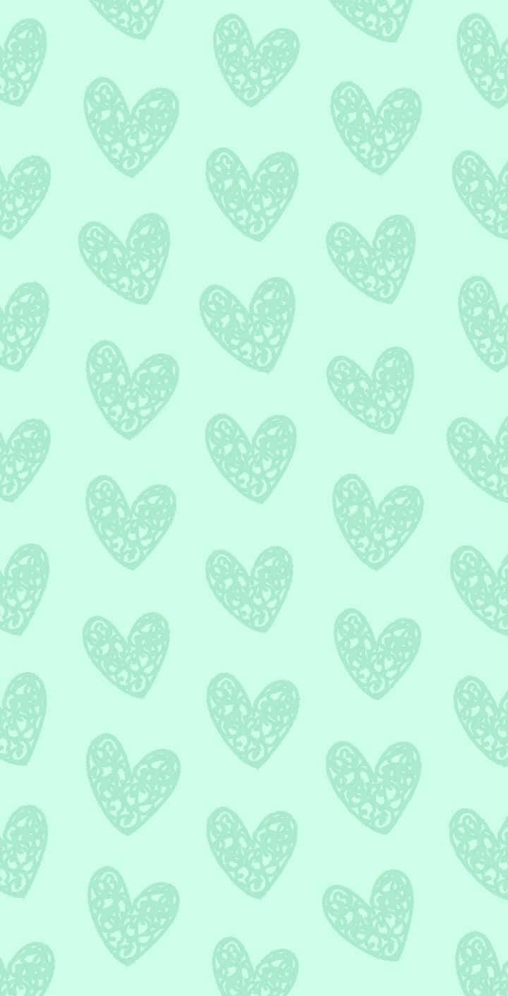 A Green Background With Hearts On It
