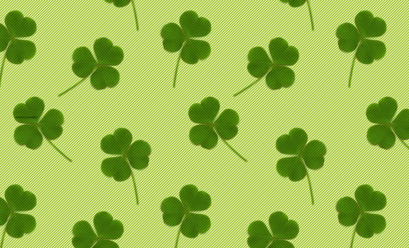 A Green Clover With Three Shamrocks In The Middle