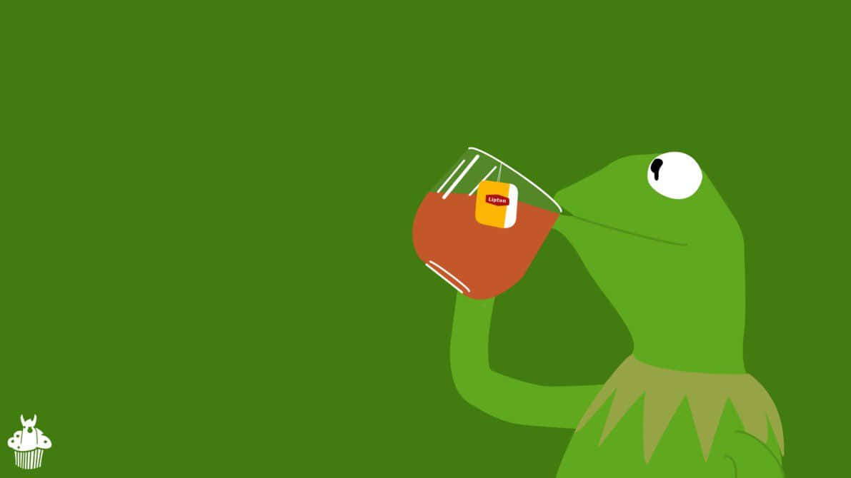 A Green Frog Drinking A Cup Of Tea Background