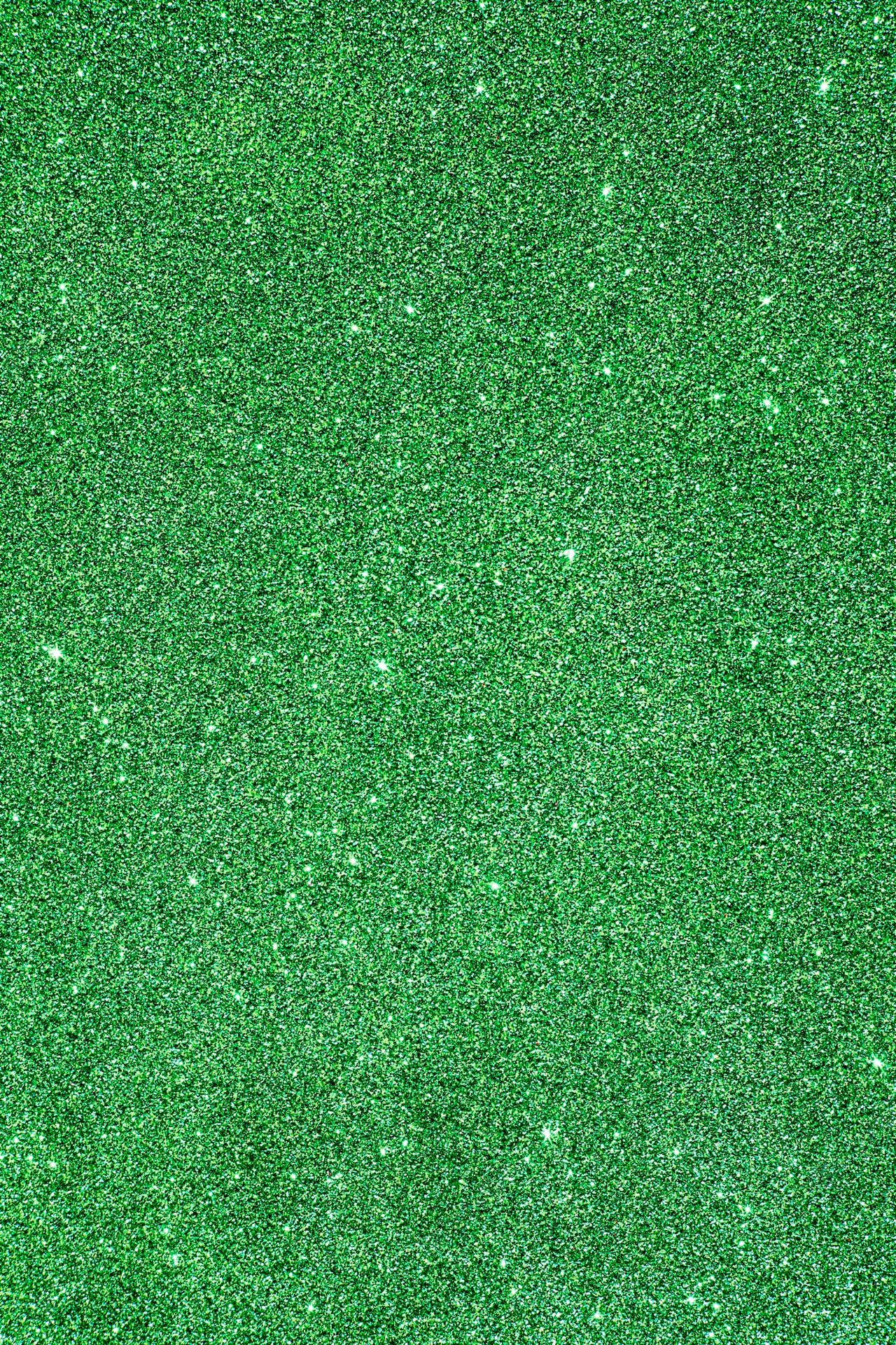 A Green Glitter Background With A Lot Of Sparkles