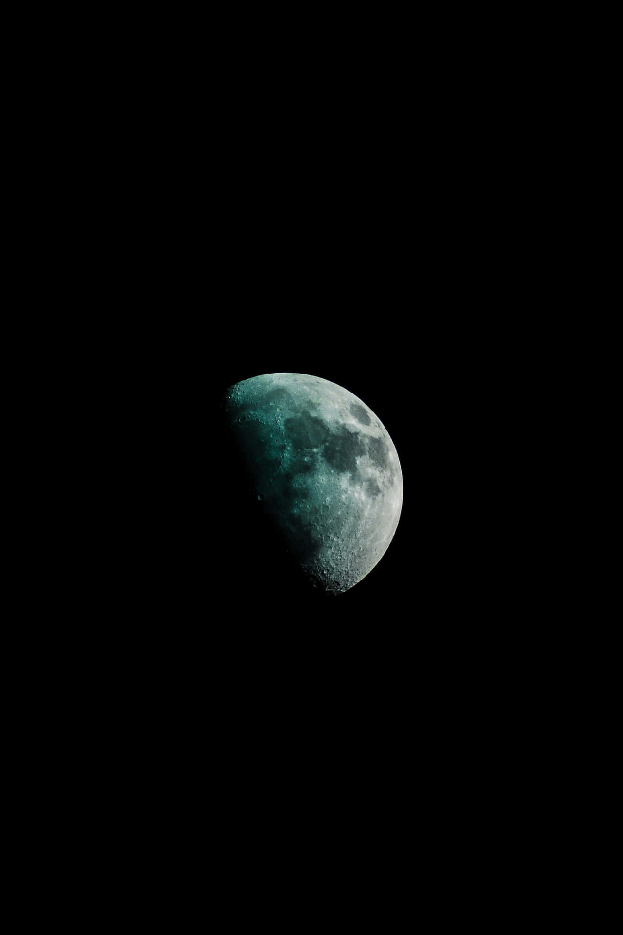 A Green Moon In The Dark Sky Background
