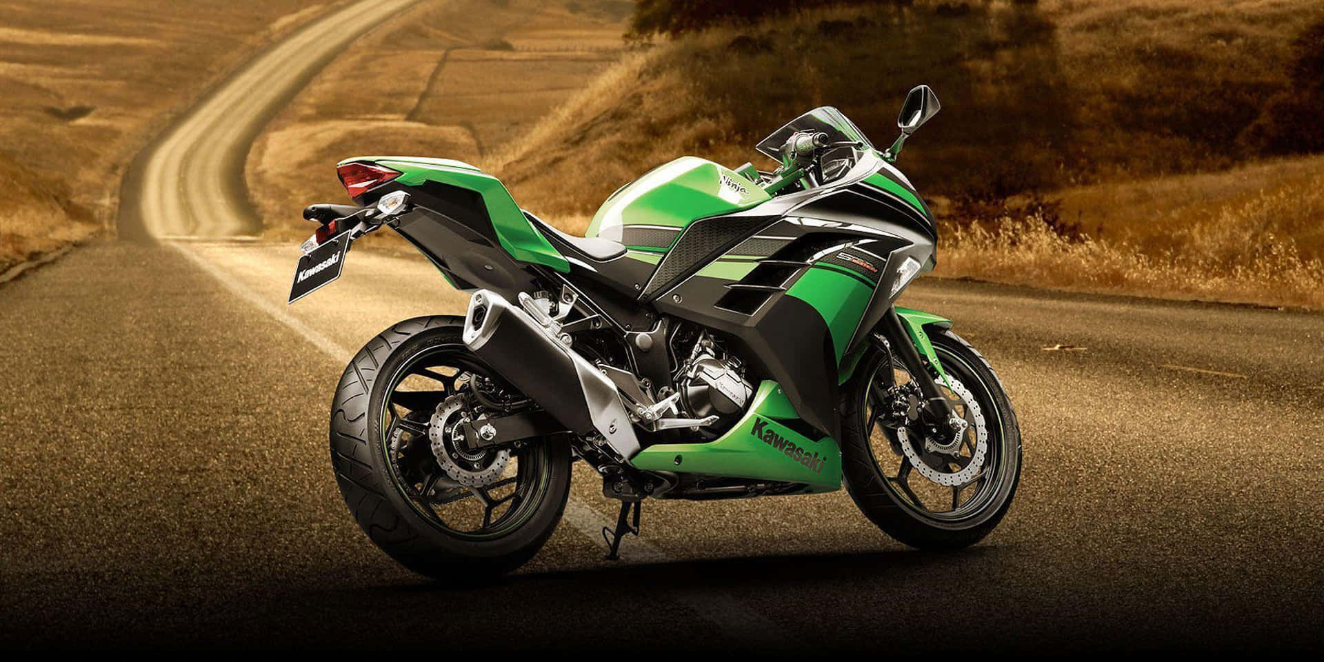 A Green Motorcycle On A Road Background