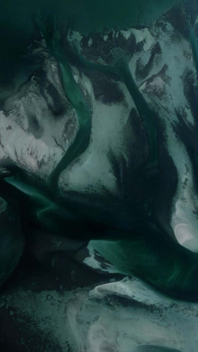 A Green River Is Flowing In The Water Background
