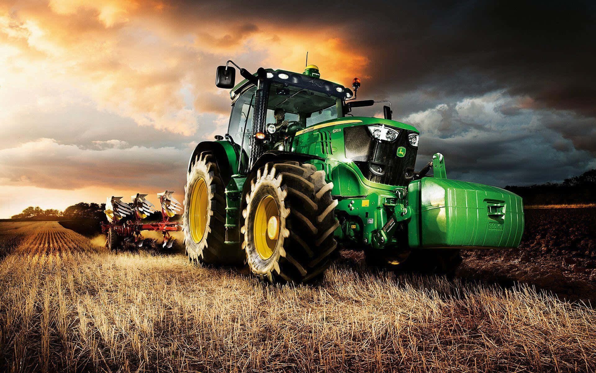 A Green Tractor Driving In A Field Background