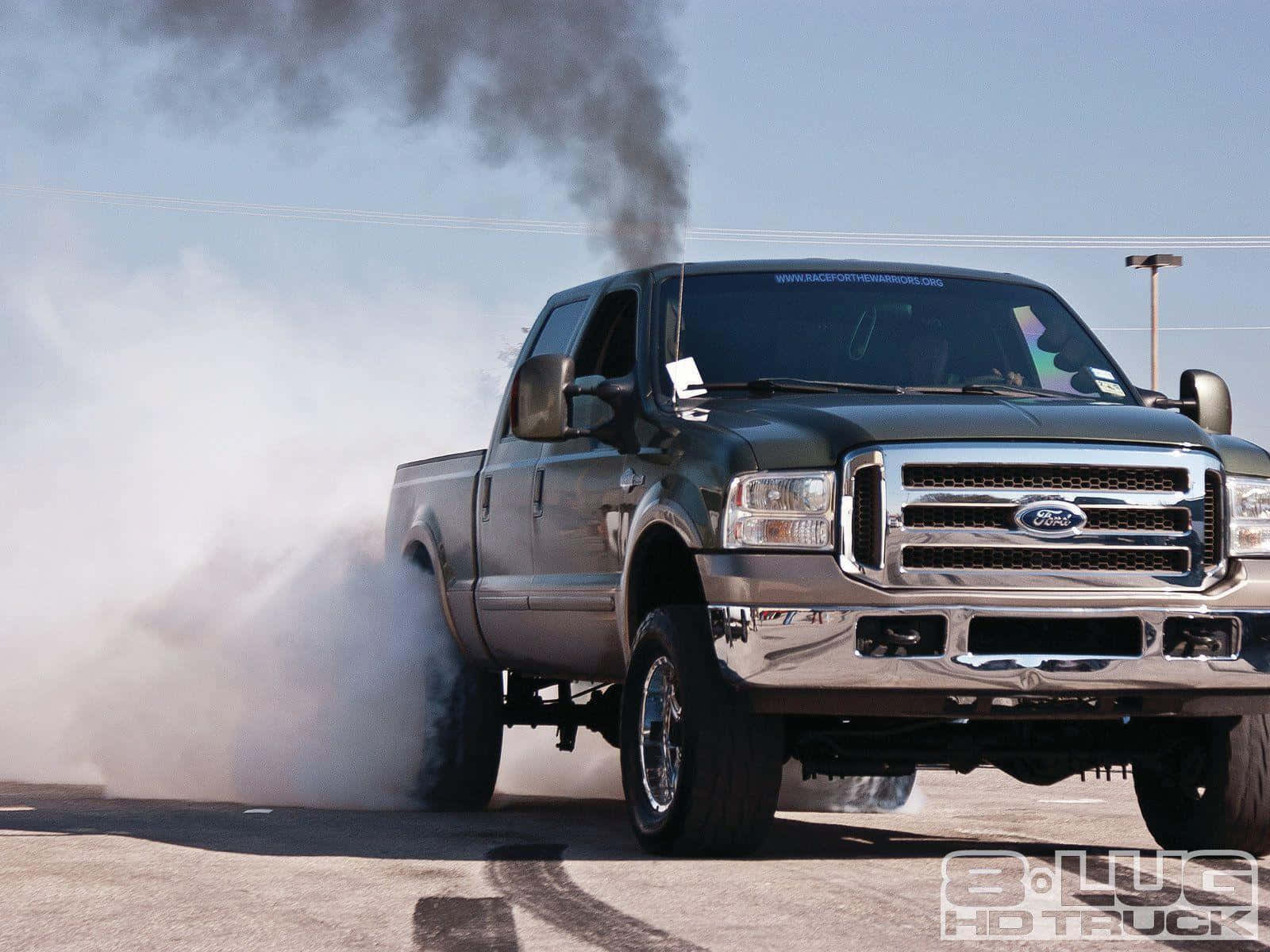 A Green Truck With Smoke Coming Out Of It