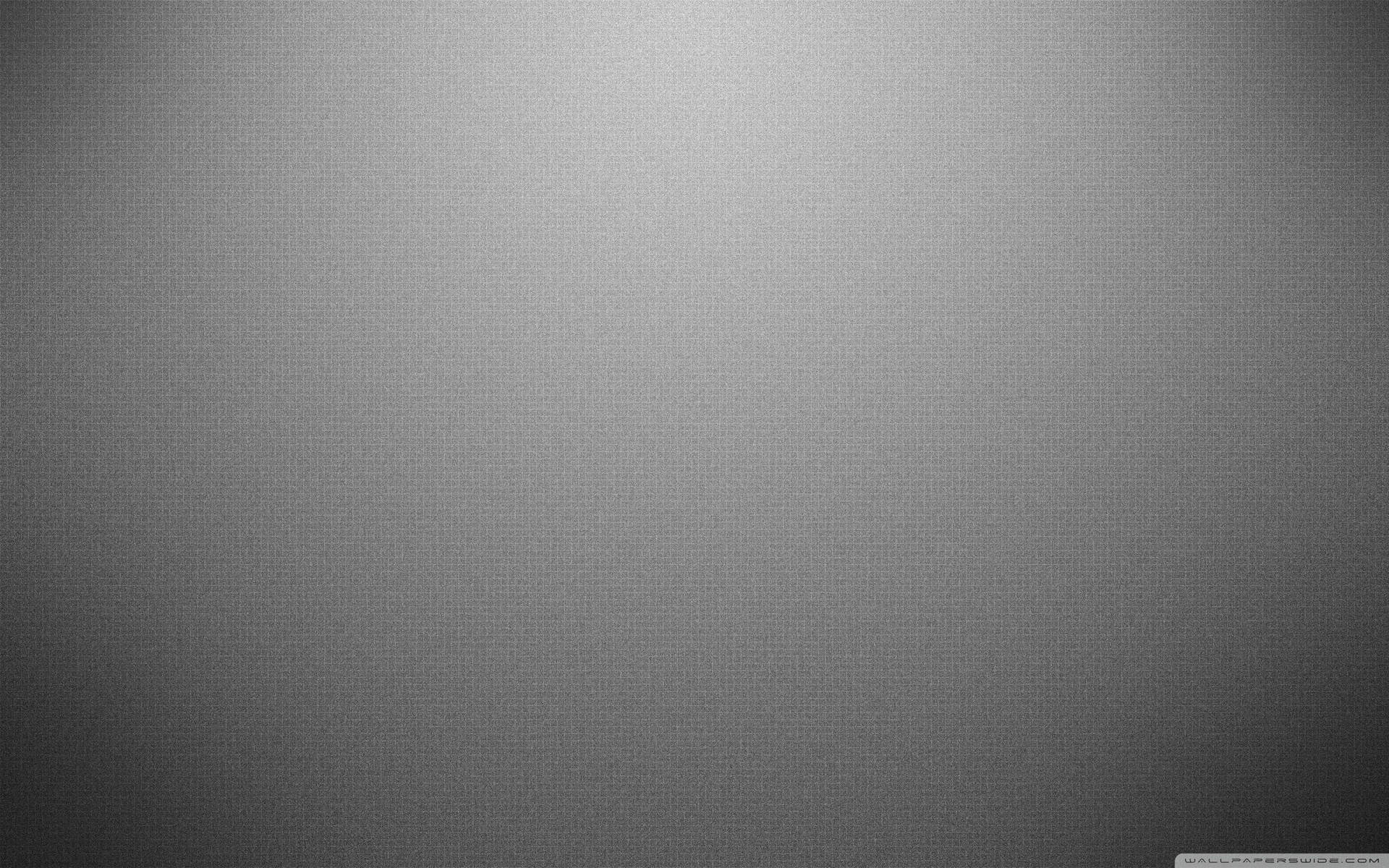 A Grey Background With A Light Shining On It Background