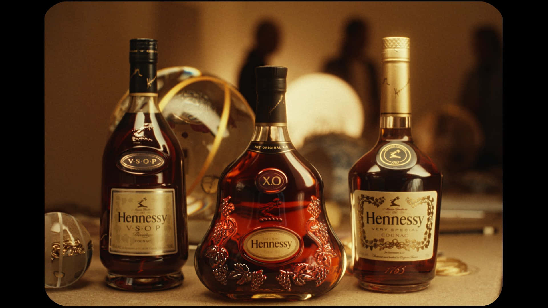 A Group Of Bottles Of Liquor On A Table Background