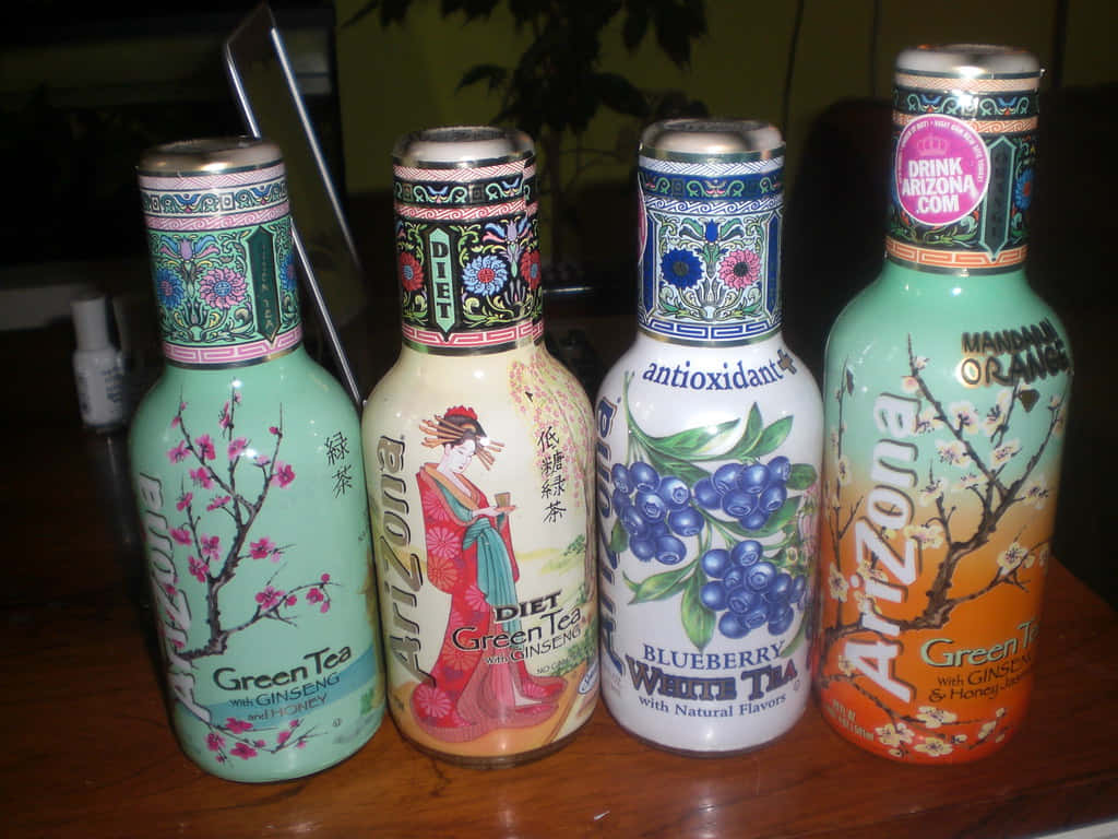 A Group Of Bottles On A Table Background