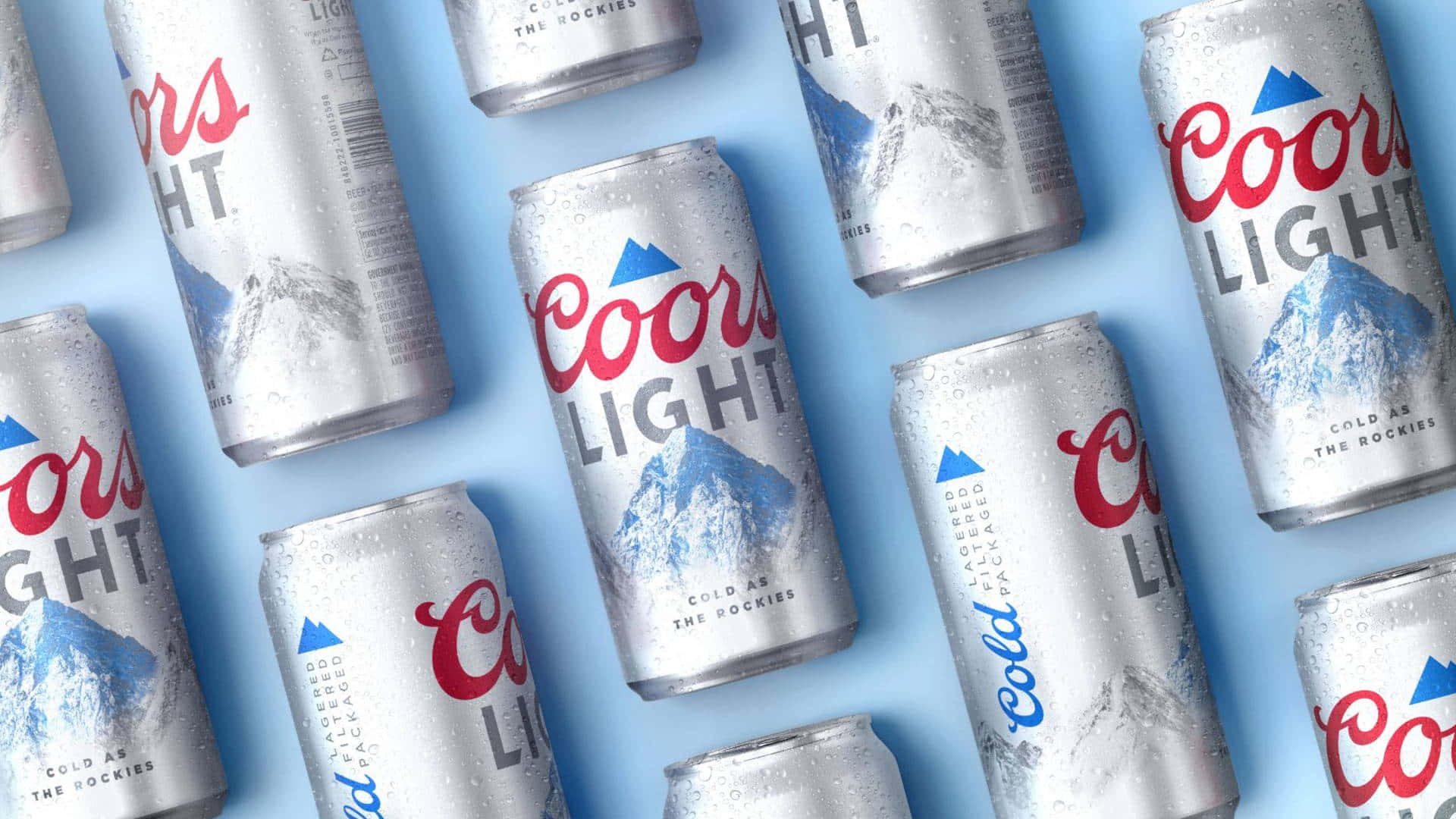 A Group Of Cans Of Coors Light Are Arranged On A Blue Surface Background