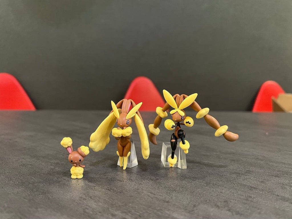 A Group Of Figurines With A Yellow And Brown Color Background