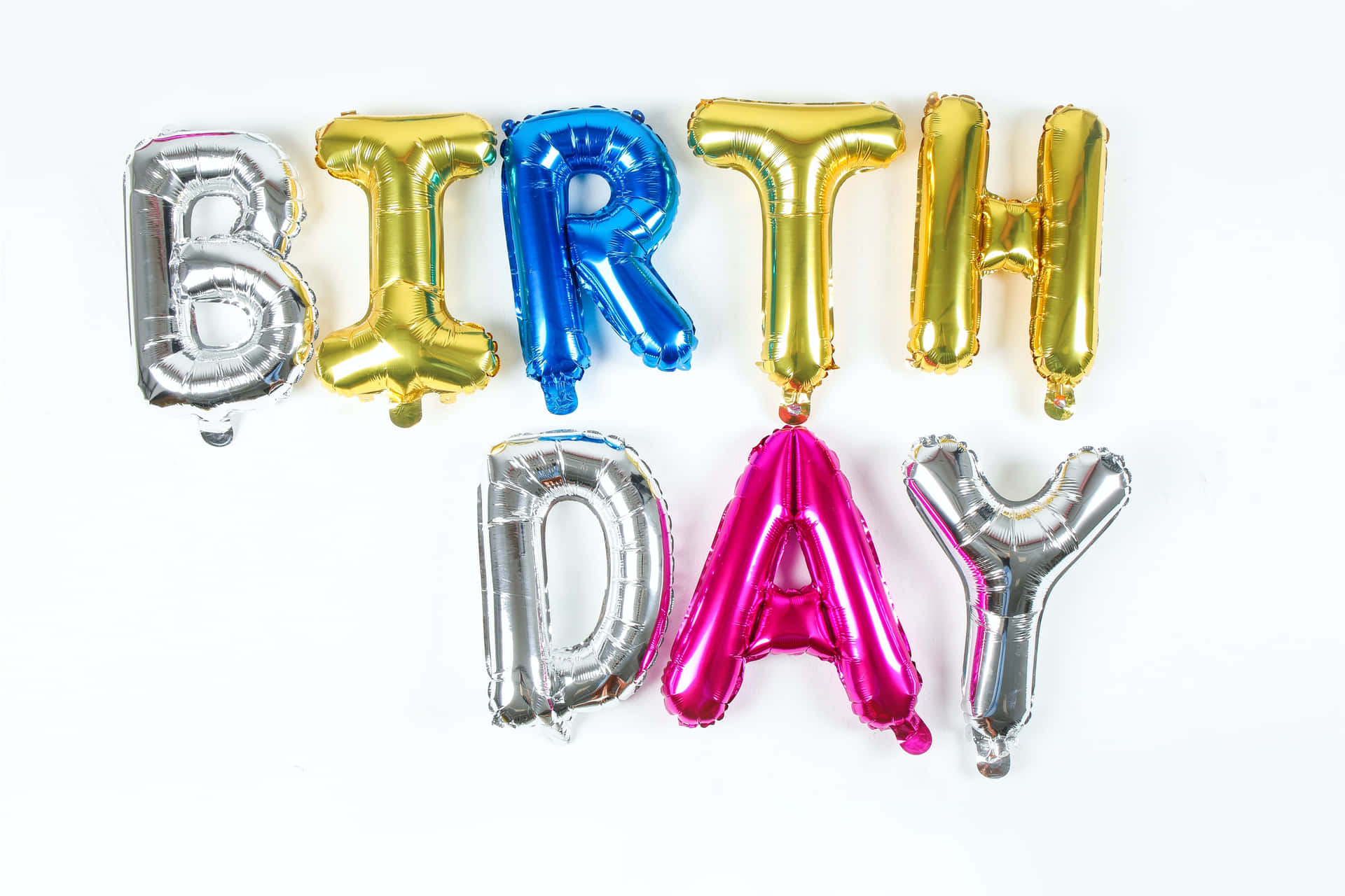 A Group Of Foil Balloons With The Word Birthday Day