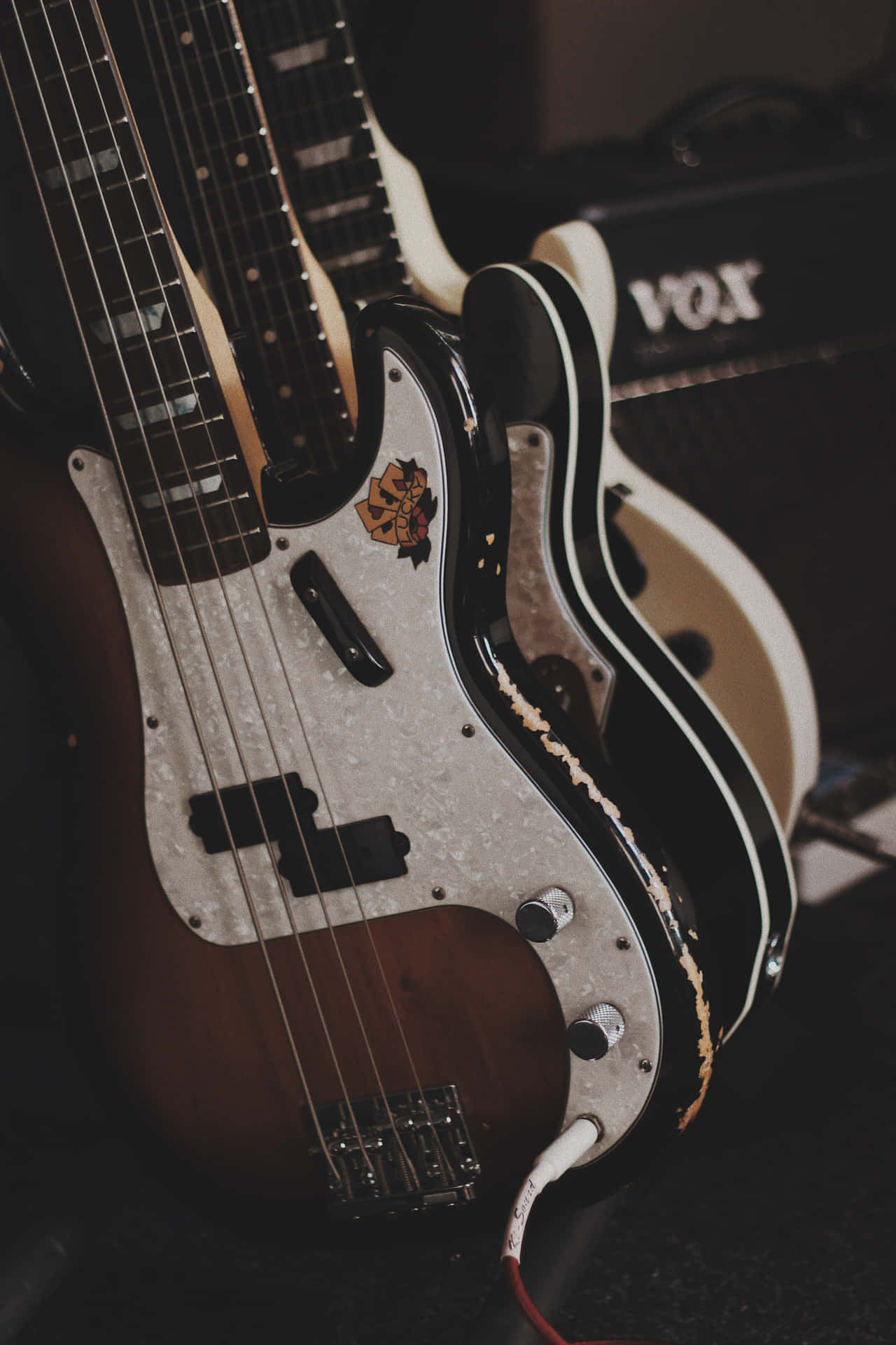 A Group Of Guitars Sitting On A Table