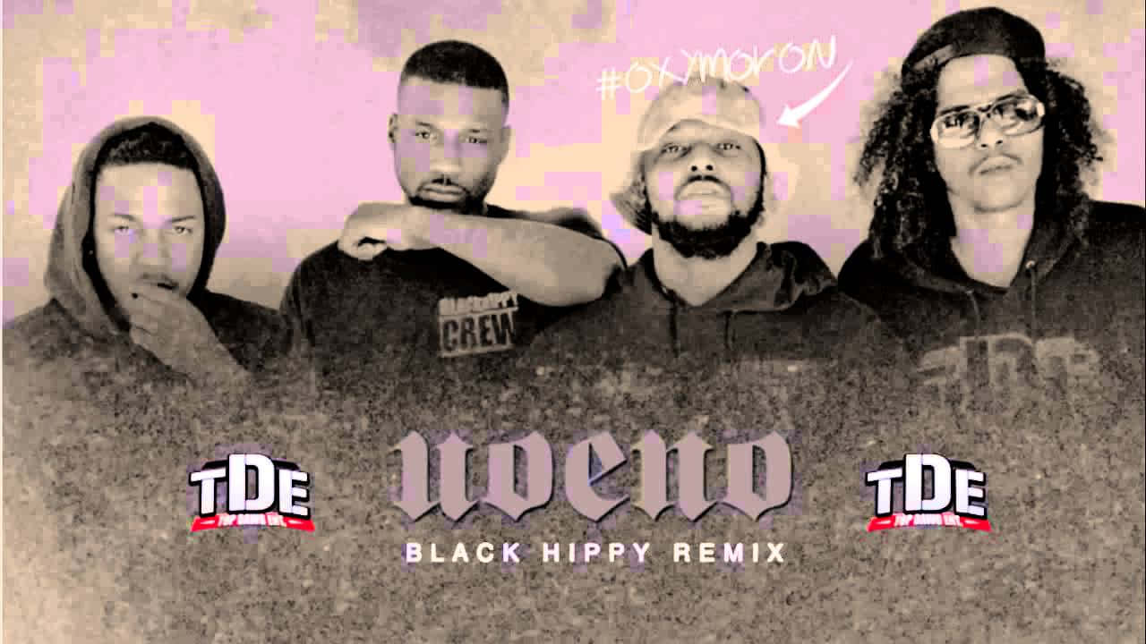 A Group Of Men In A Black Shirt With The Words'nedo Black Hip Hop Remix' Background