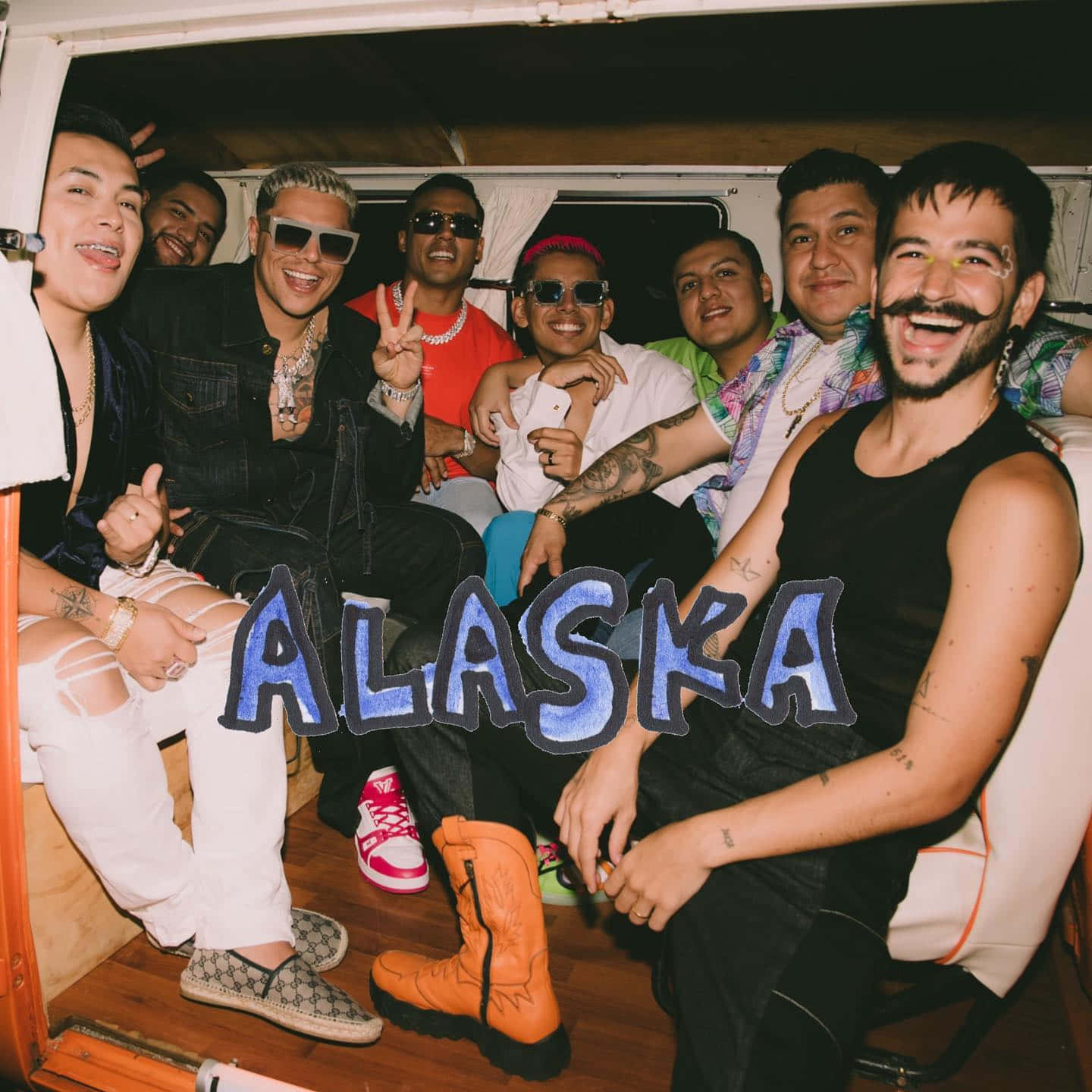 A Group Of Men In A Van With The Word Alaska Background