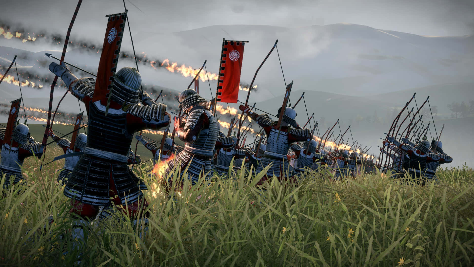 A Group Of Men In Armor Are Fighting In A Field Background