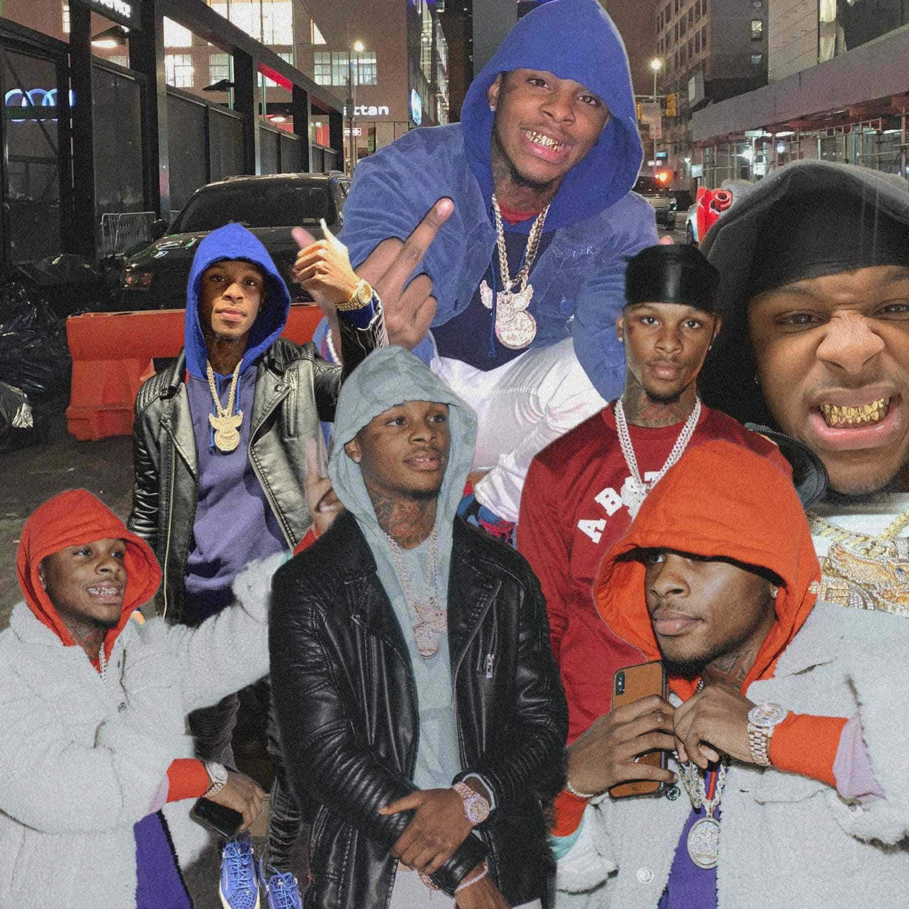 A Group Of Men In Hoodies Background