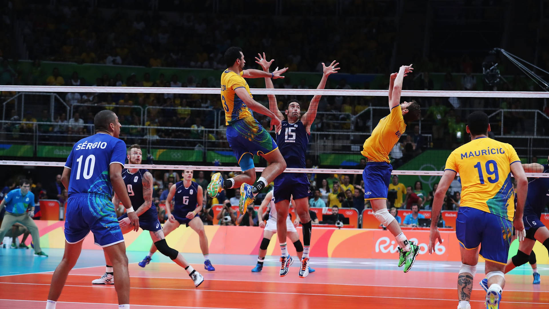 A Group Of Men Playing Volleyball In A Game Background