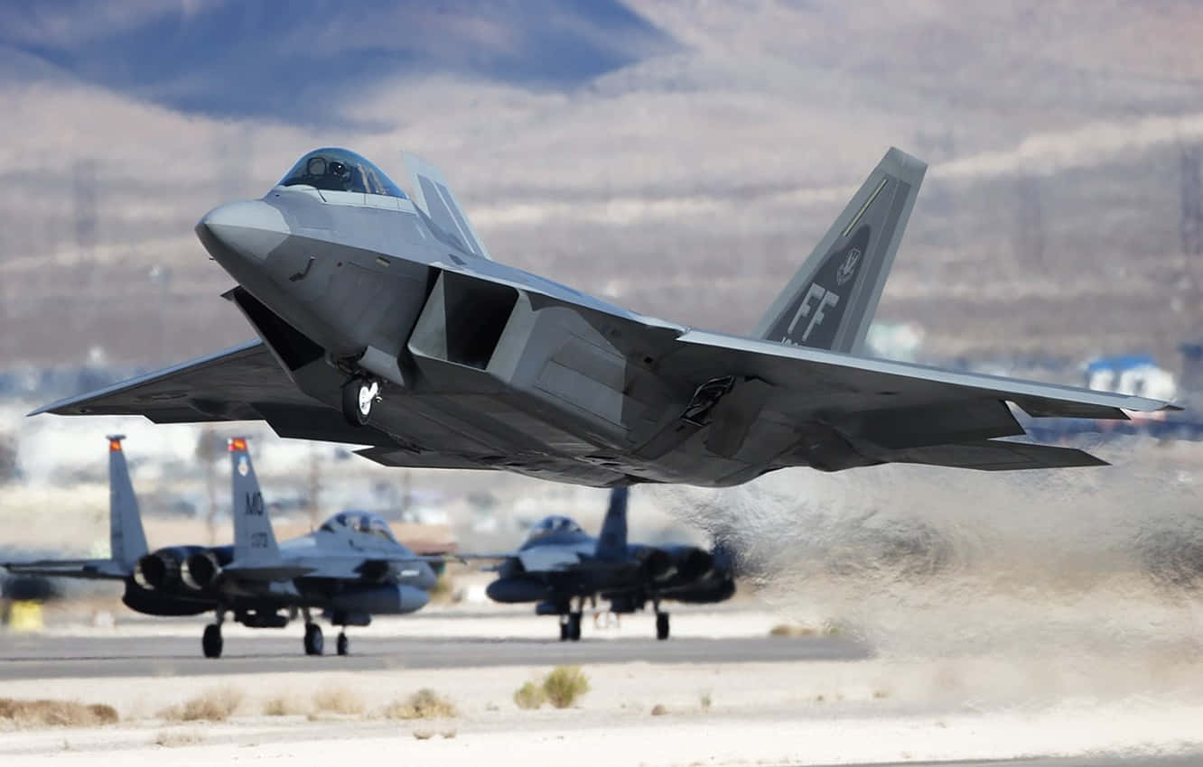 A Group Of Military Jets Are Taking Off From An Airport Background