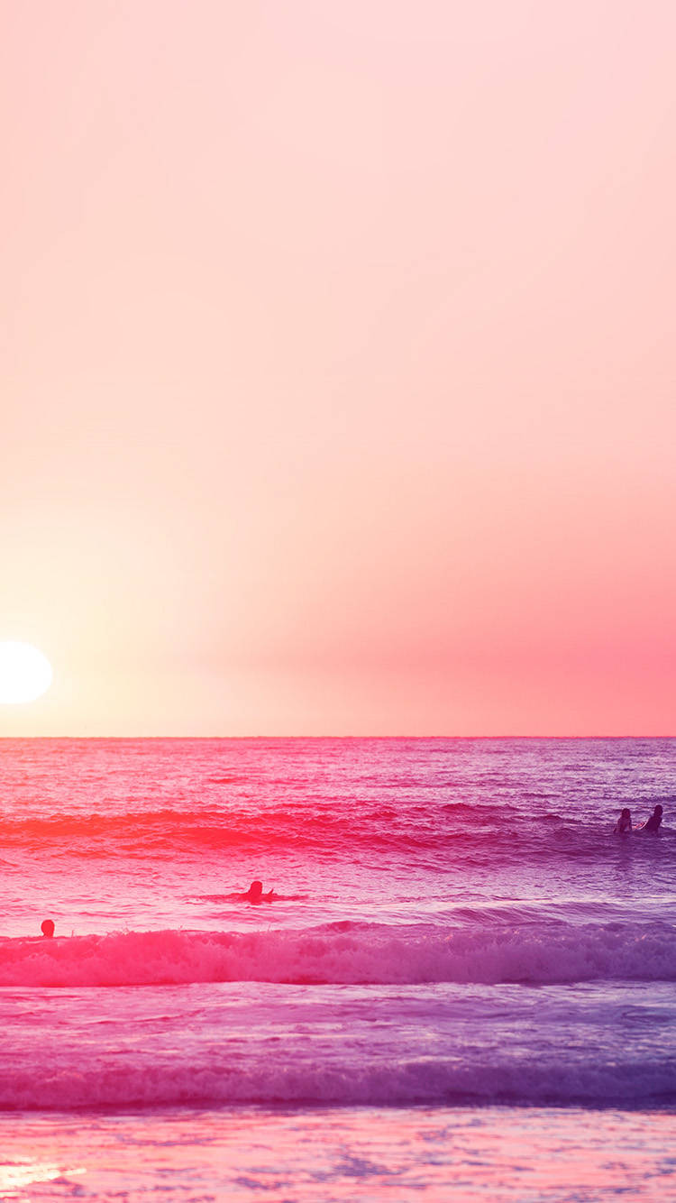 A Group Of People Are Surfing In The Ocean Background