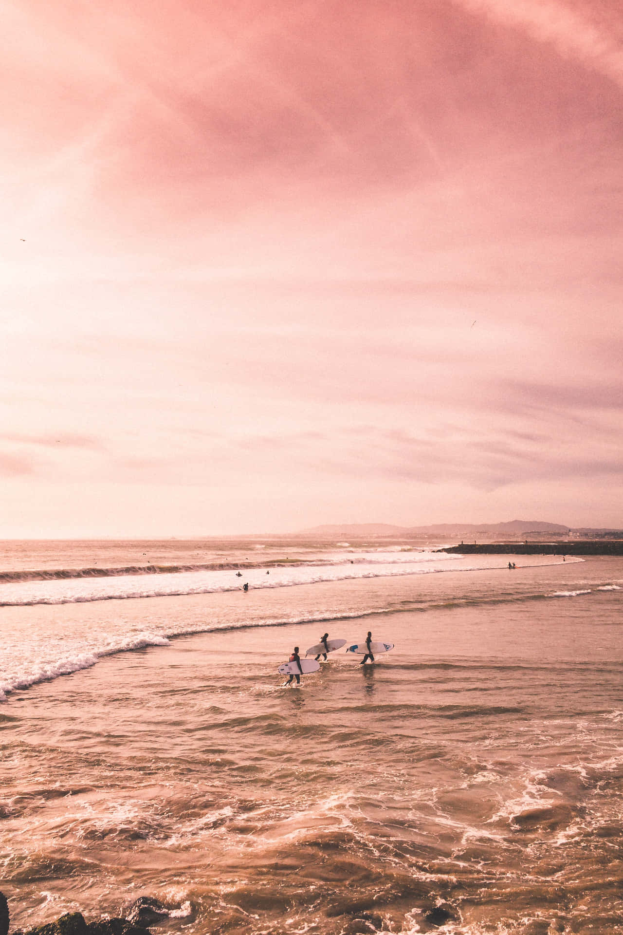 A Group Of People Are Surfing On The Ocean Background