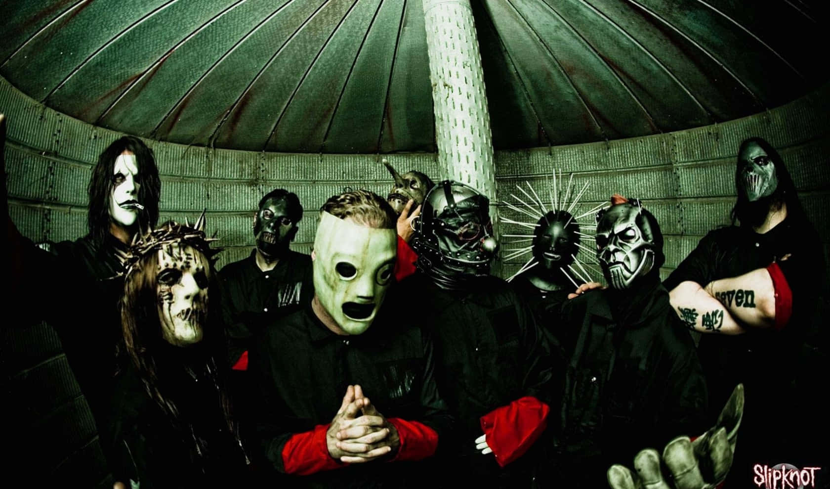 A Group Of People In Masks Standing In A Room Background