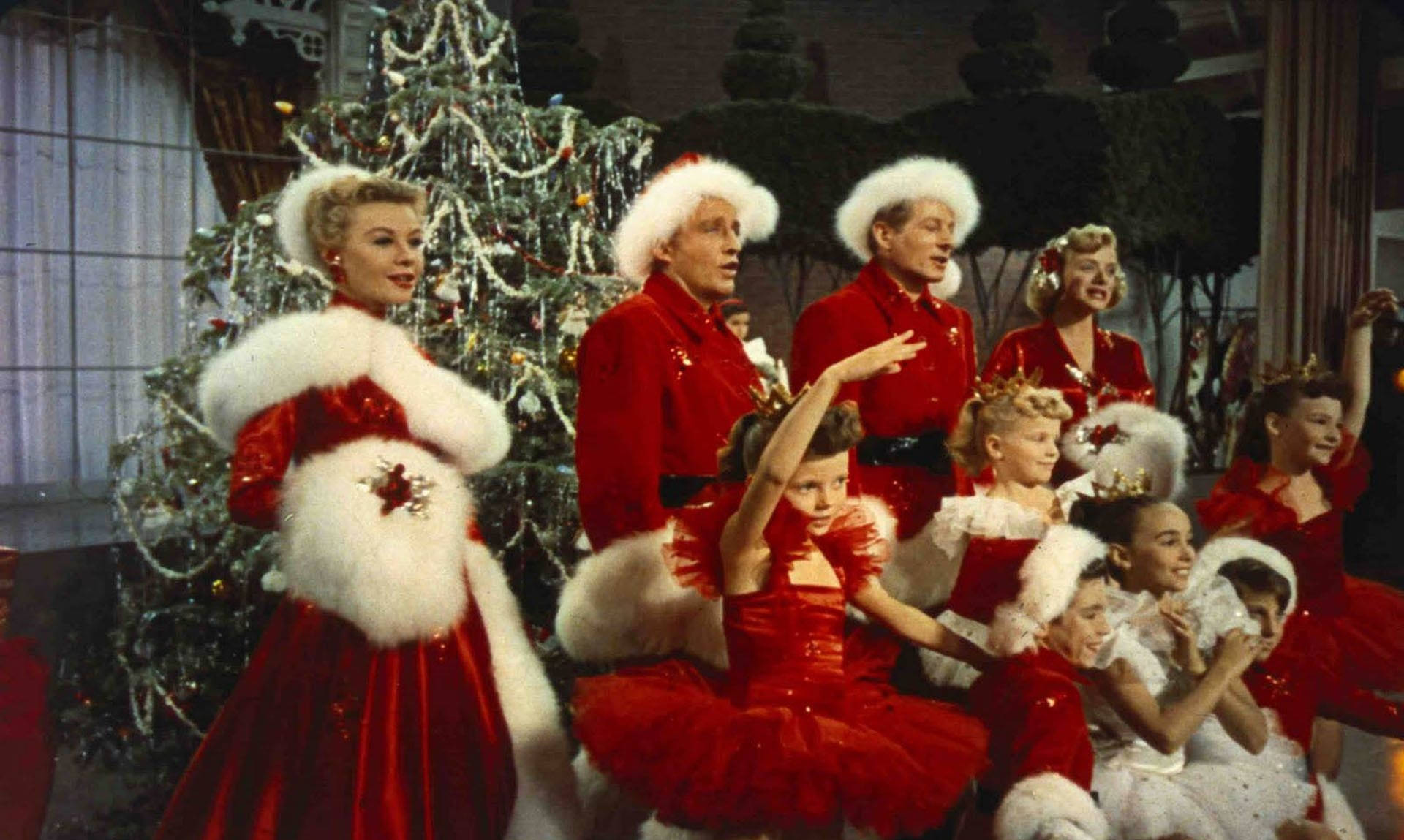 A Group Of People In Santa Suits Posing For A Picture Background