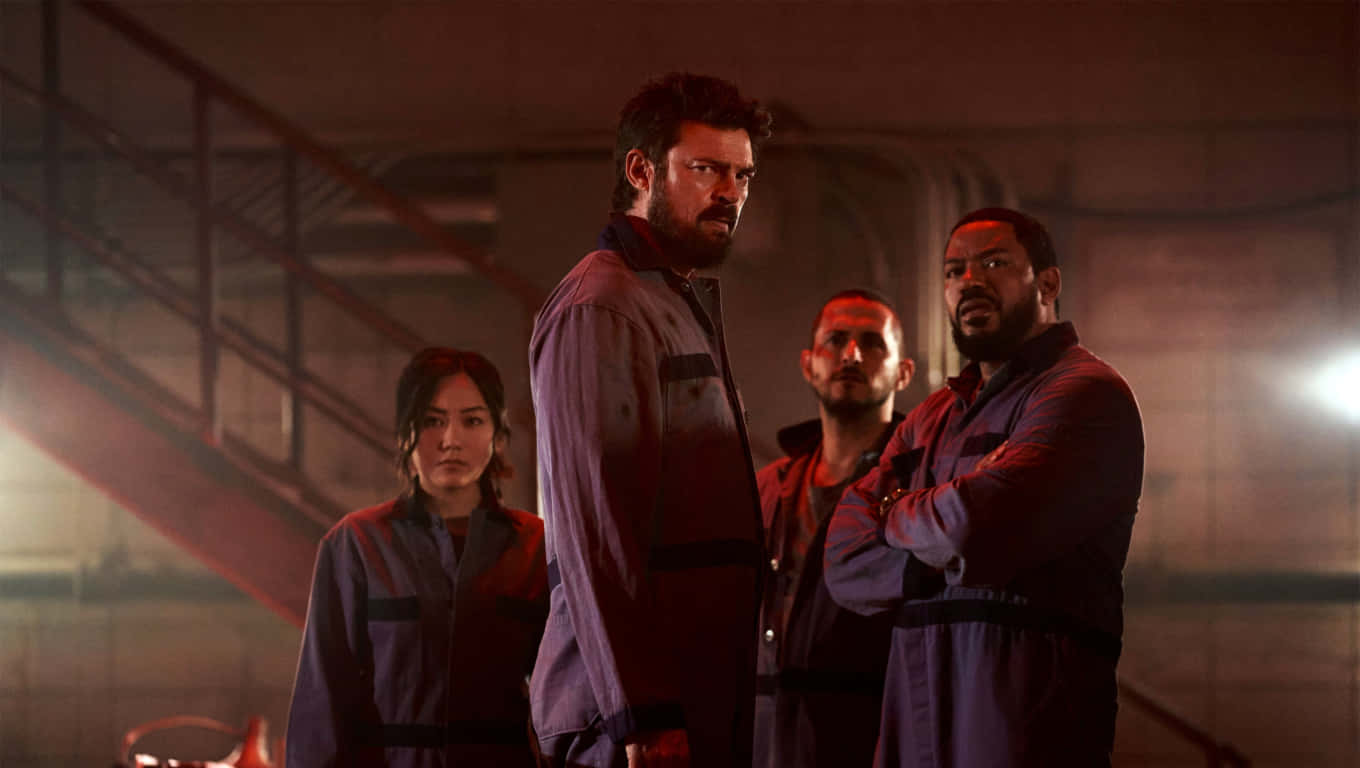 A Group Of People In Uniforms Standing In A Dark Room Background