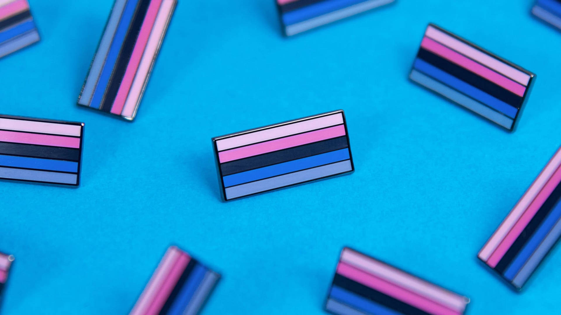 A Group Of Pins With Different Colors On Them Background