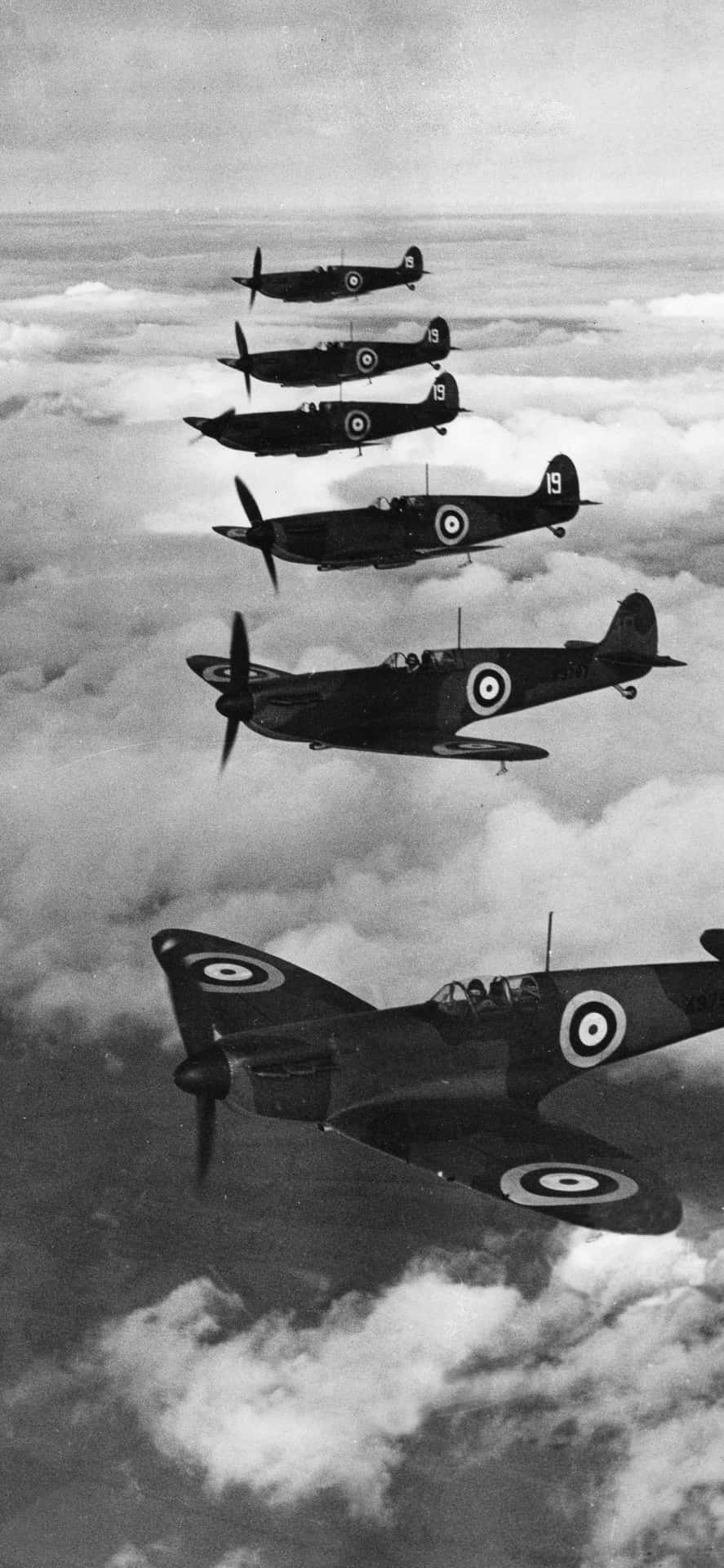 A Group Of Planes Flying In The Sky Background