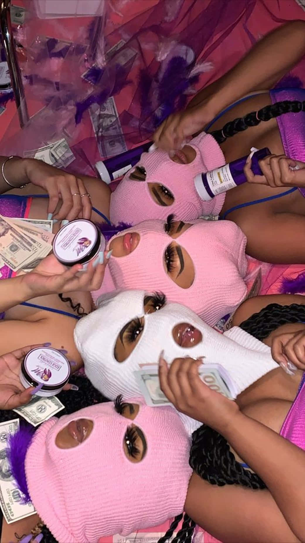 A Group Of Women With Masks And Money On Their Heads