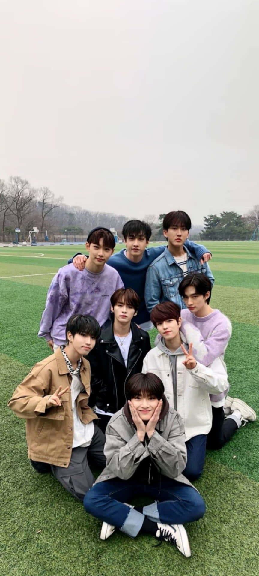 A Group Of Young Men Posing For A Photo Background