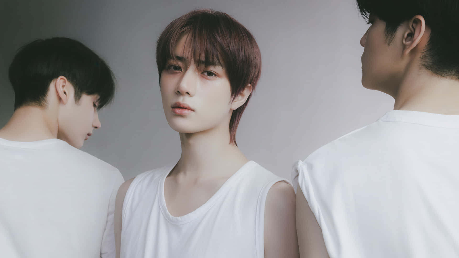 A Group Of Young Men Standing In Front Of A White Background Background