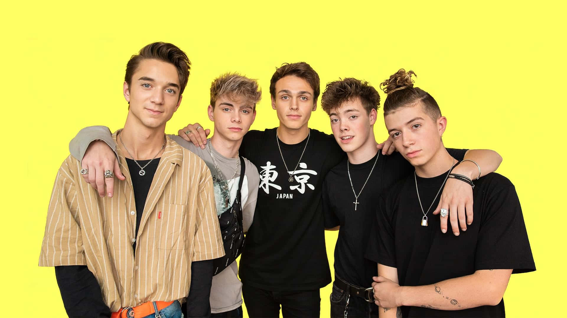 A Group Of Young Men Standing Together Background