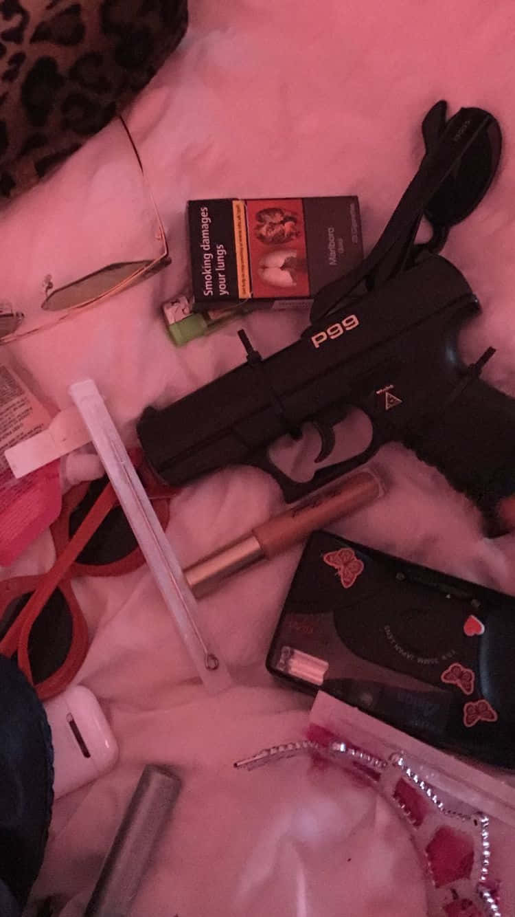 A Gun, A Purse, And A Cell Phone Background