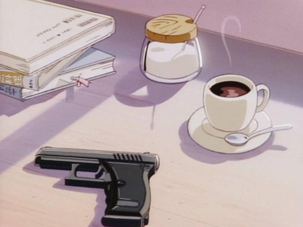 A Gun And Coffee On A Table Background