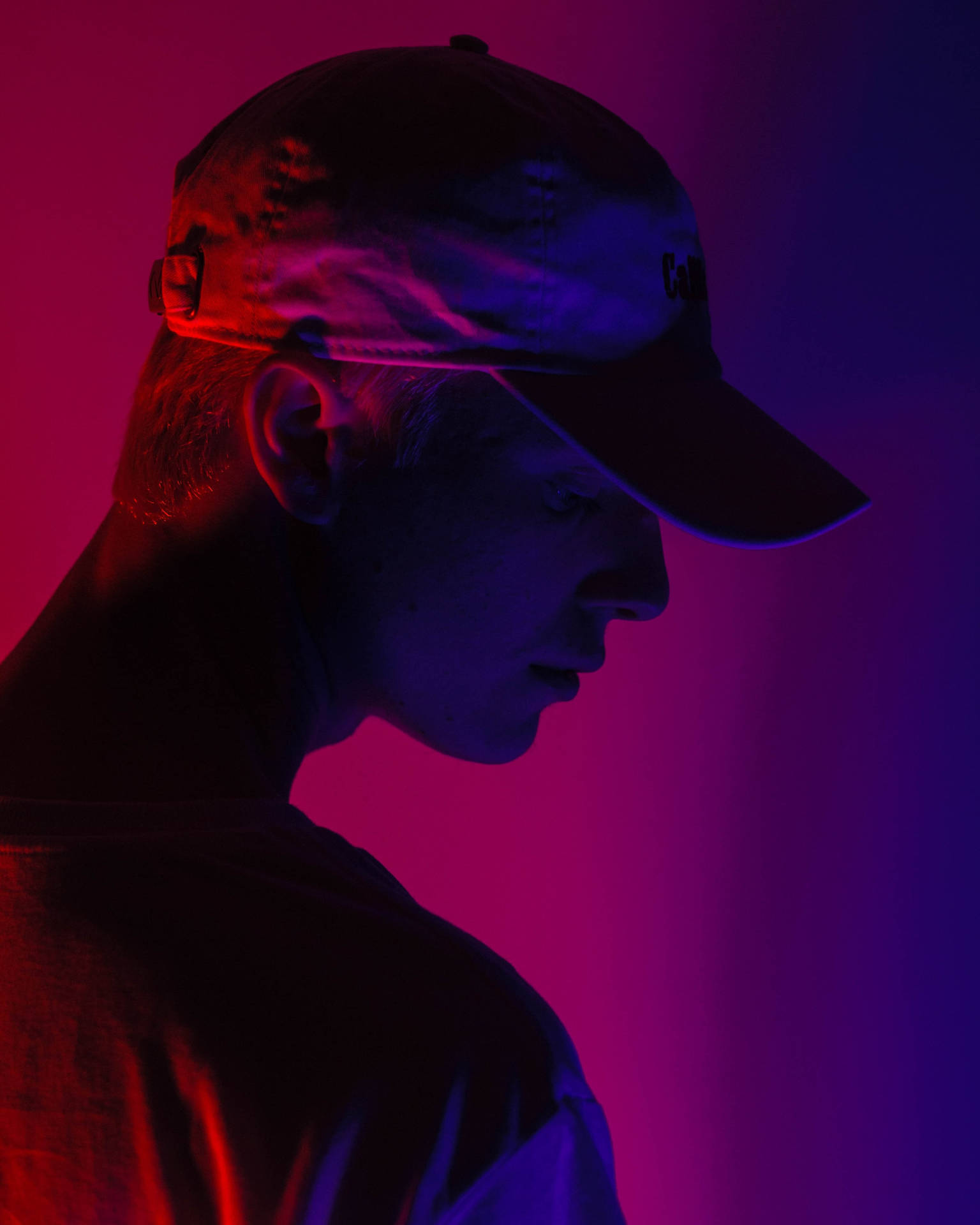 A Guy In A Cap Profile In Ombré Background