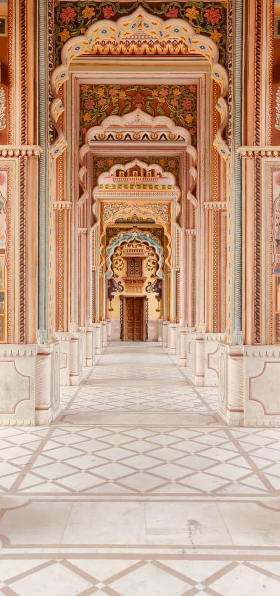 A Hallway In An Ornate Building With White Walls Background