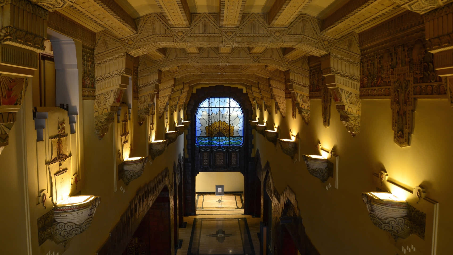 A Hallway With A Large Window Background