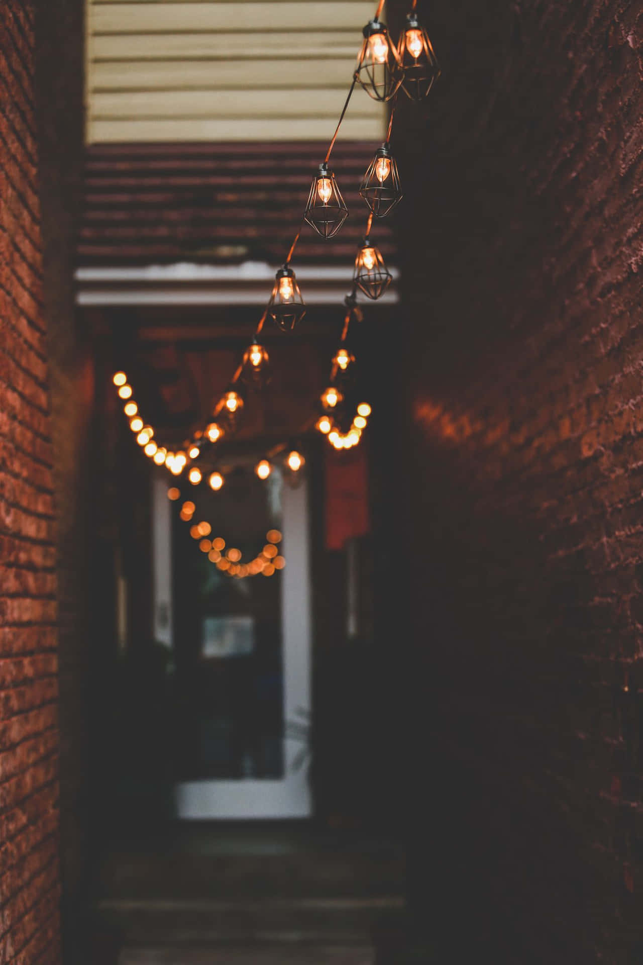 A Hallway With String Lights Hanging From The Ceiling