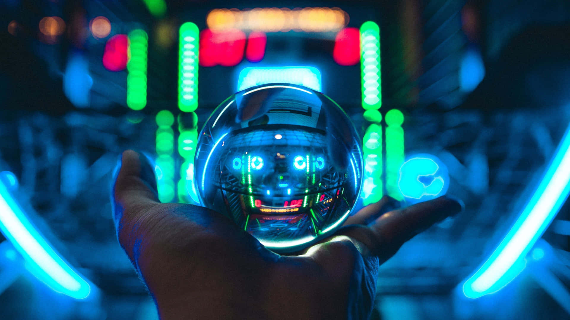 A Hand Holding A Glowing Ball In Front Of Neon Lights Background