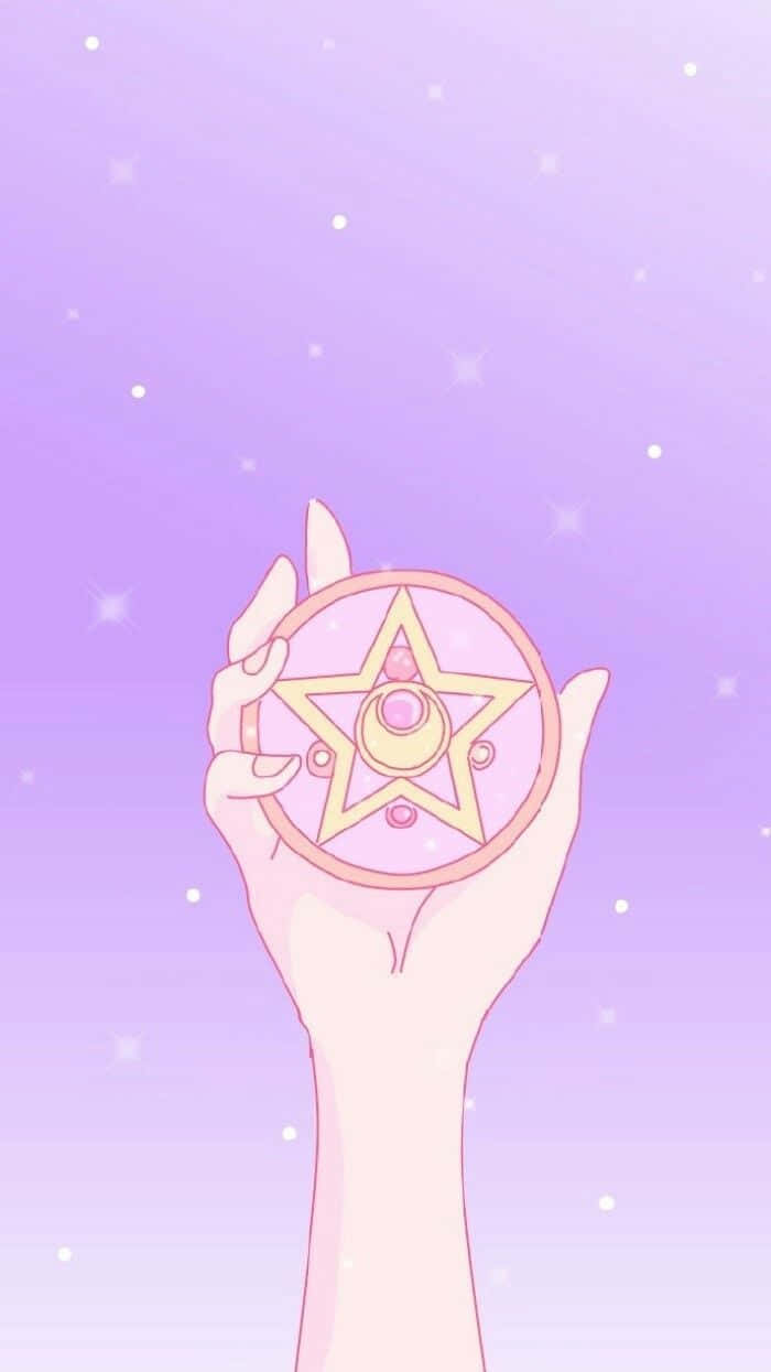 A Hand Holding A Star Shaped Disc