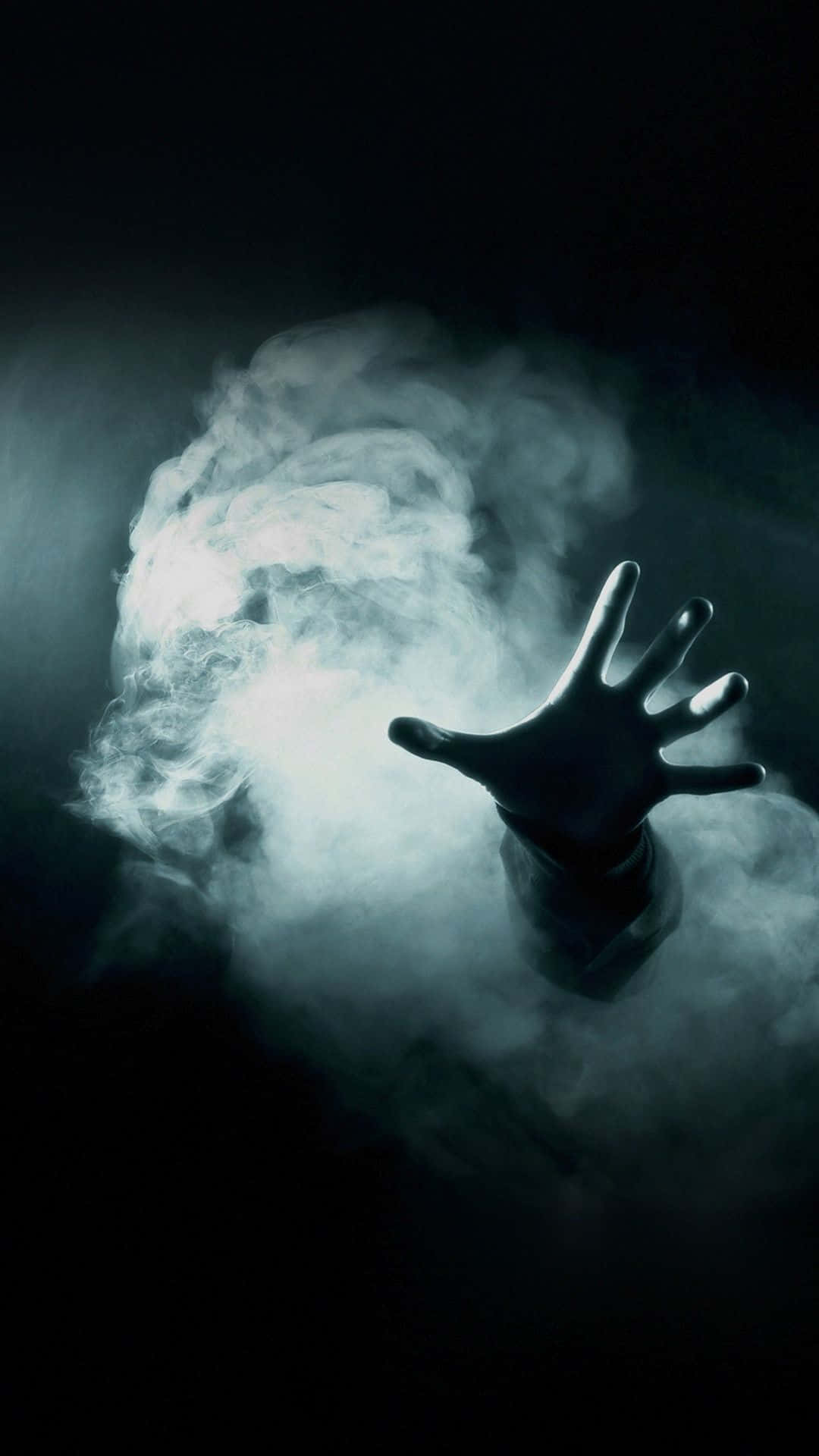 A Hand Is Reaching Out Of A Dark Room