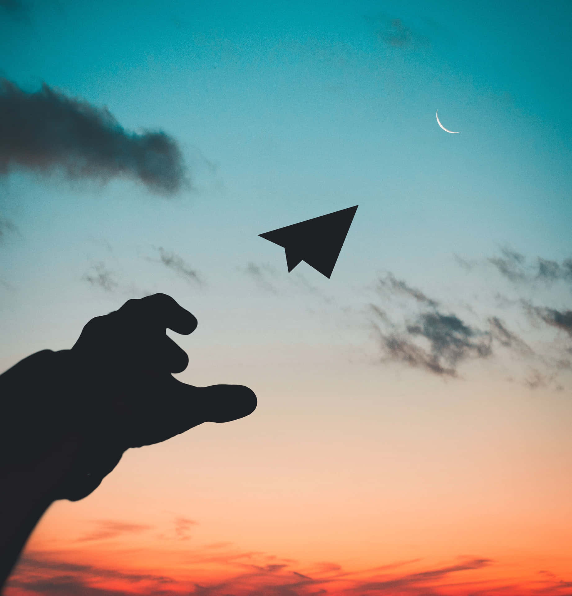 A Hand Reaching Out To A Paper Airplane