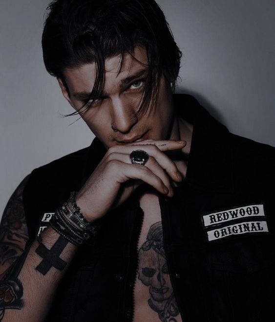 A Handsome Bad Boy In A Black Leather Jacket Background