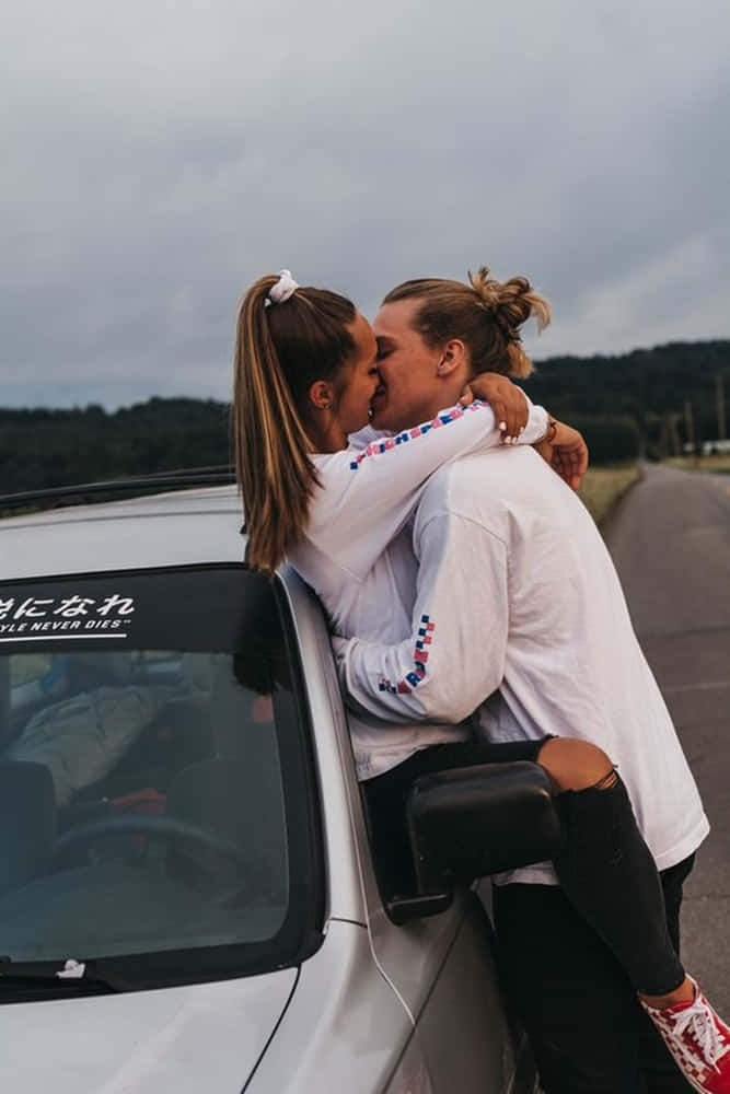 A Happy Couple Enjoying A Lovely Day Outdoors. Background