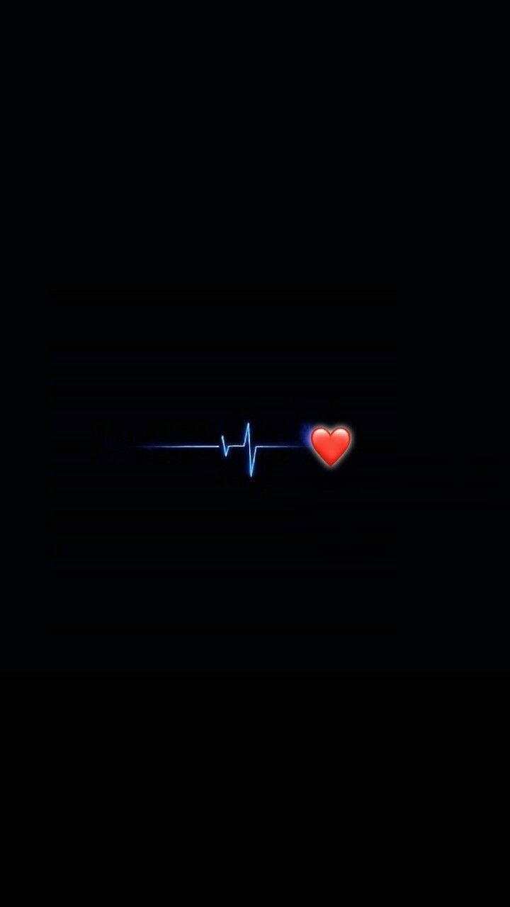 A Heartbeat With A Red Heart On It