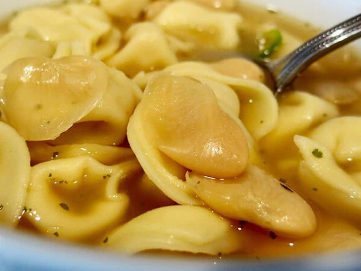 A Hearty Spoonful Of Tortellini In Brodo Background