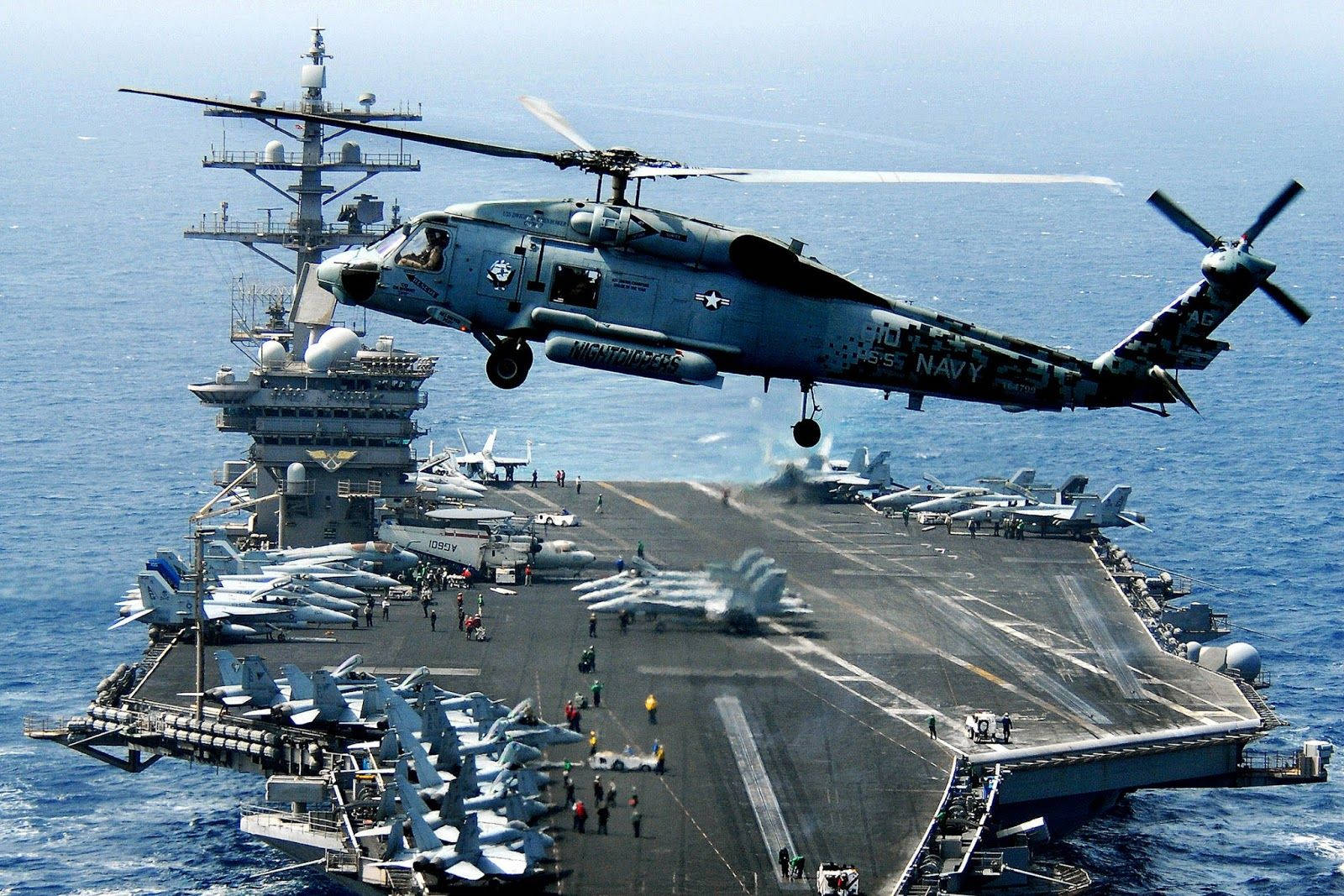 A Helicopter Flying Over A Ship Background