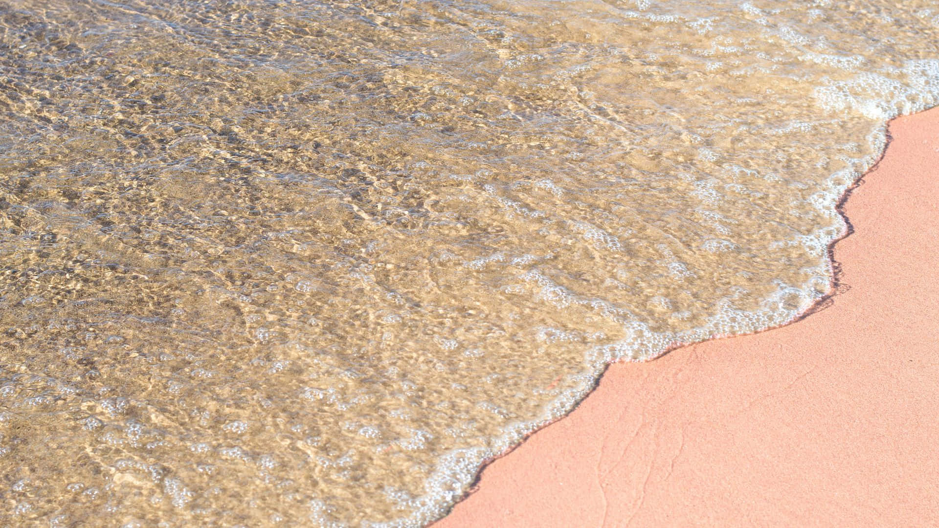 A Hidden Paradise: Breathtaking View Of The Stunning Pink Beach Background